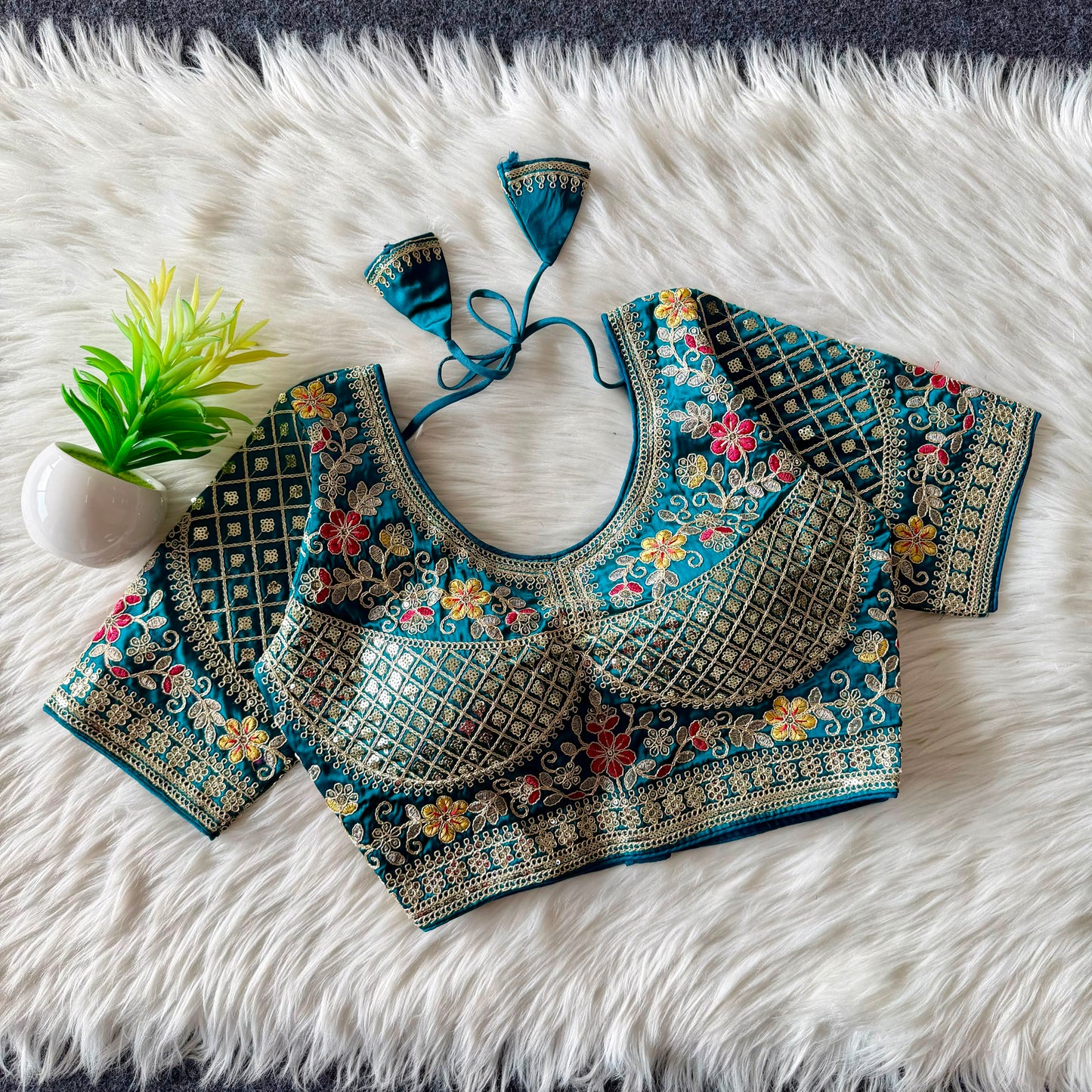 A beautiful  work with  sequence all over ready made blouse