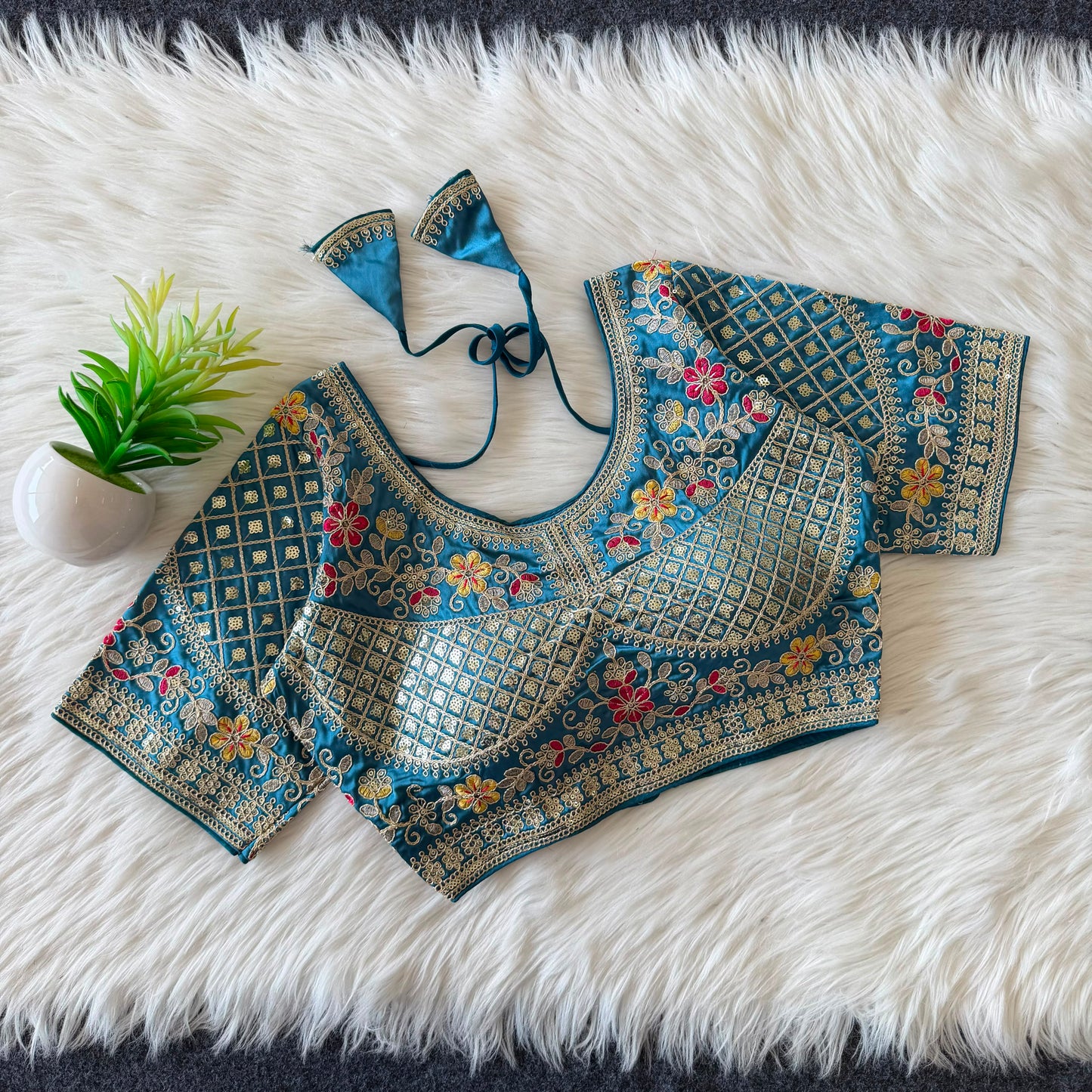A beautiful  work with  sequence all over ready made blouse