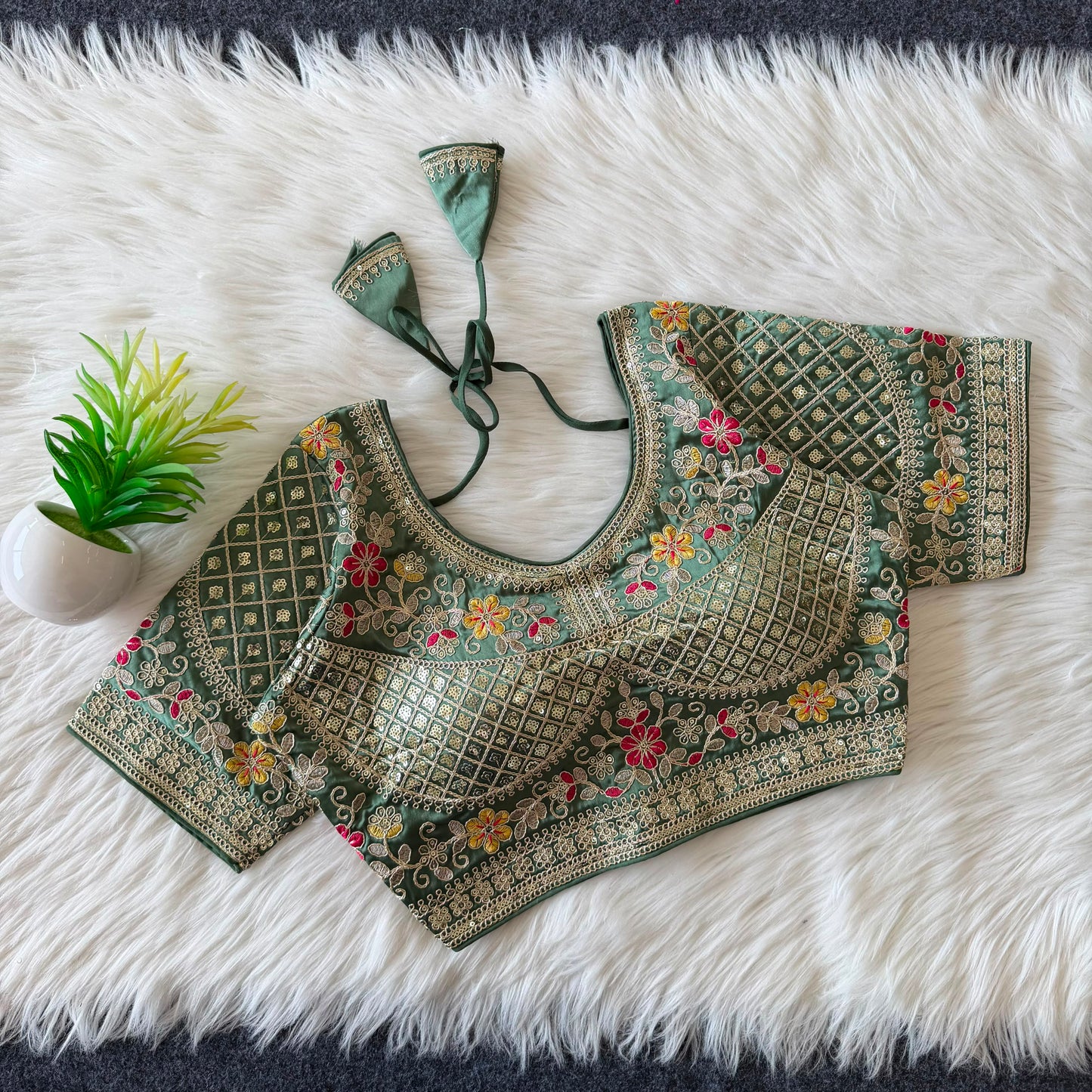 A beautiful  work with  sequence all over ready made blouse