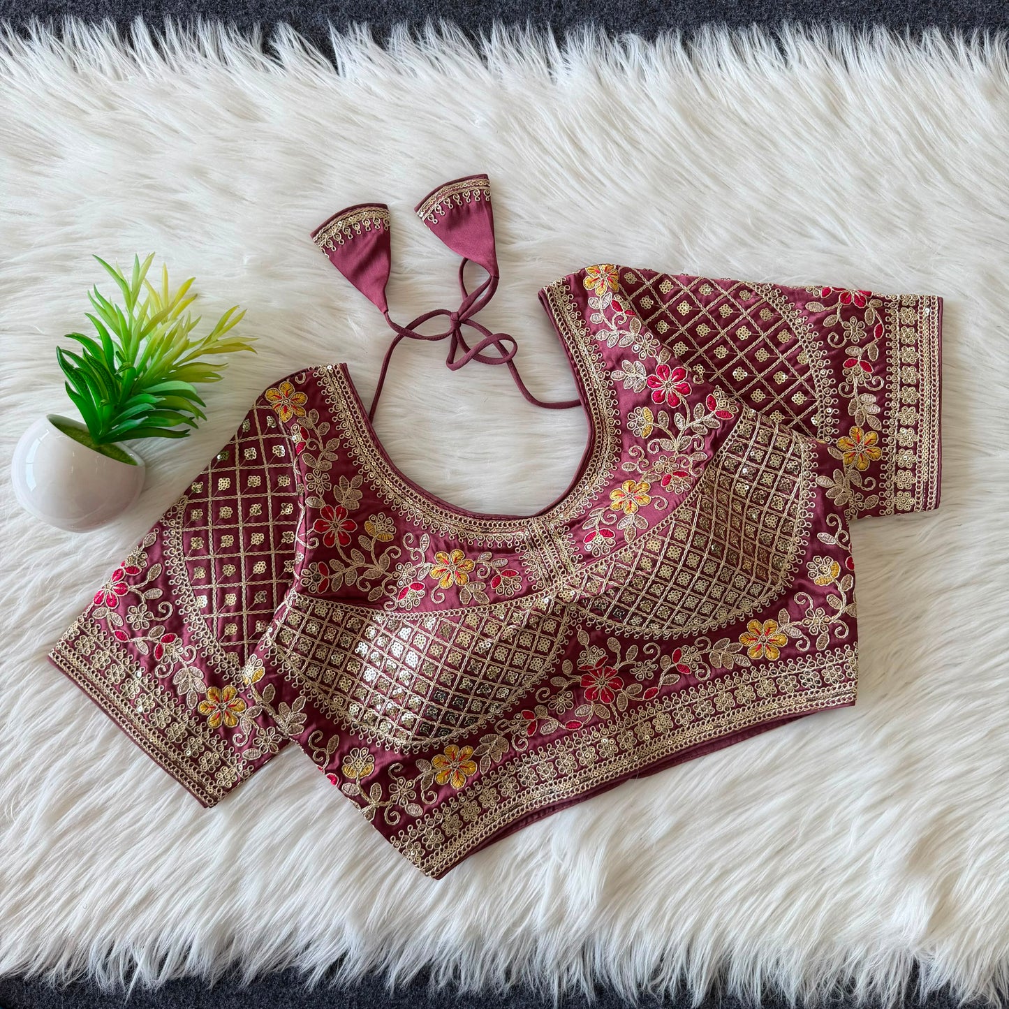 A beautiful  work with  sequence all over ready made blouse
