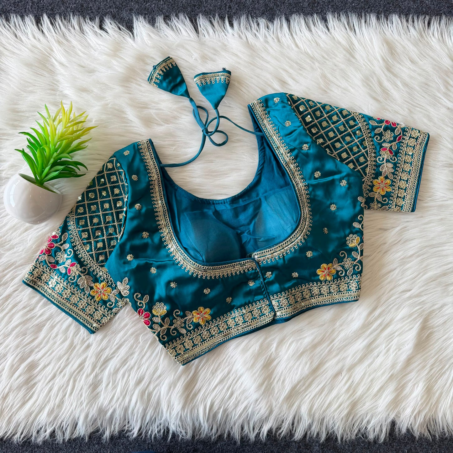 A beautiful  work with  sequence all over ready made blouse