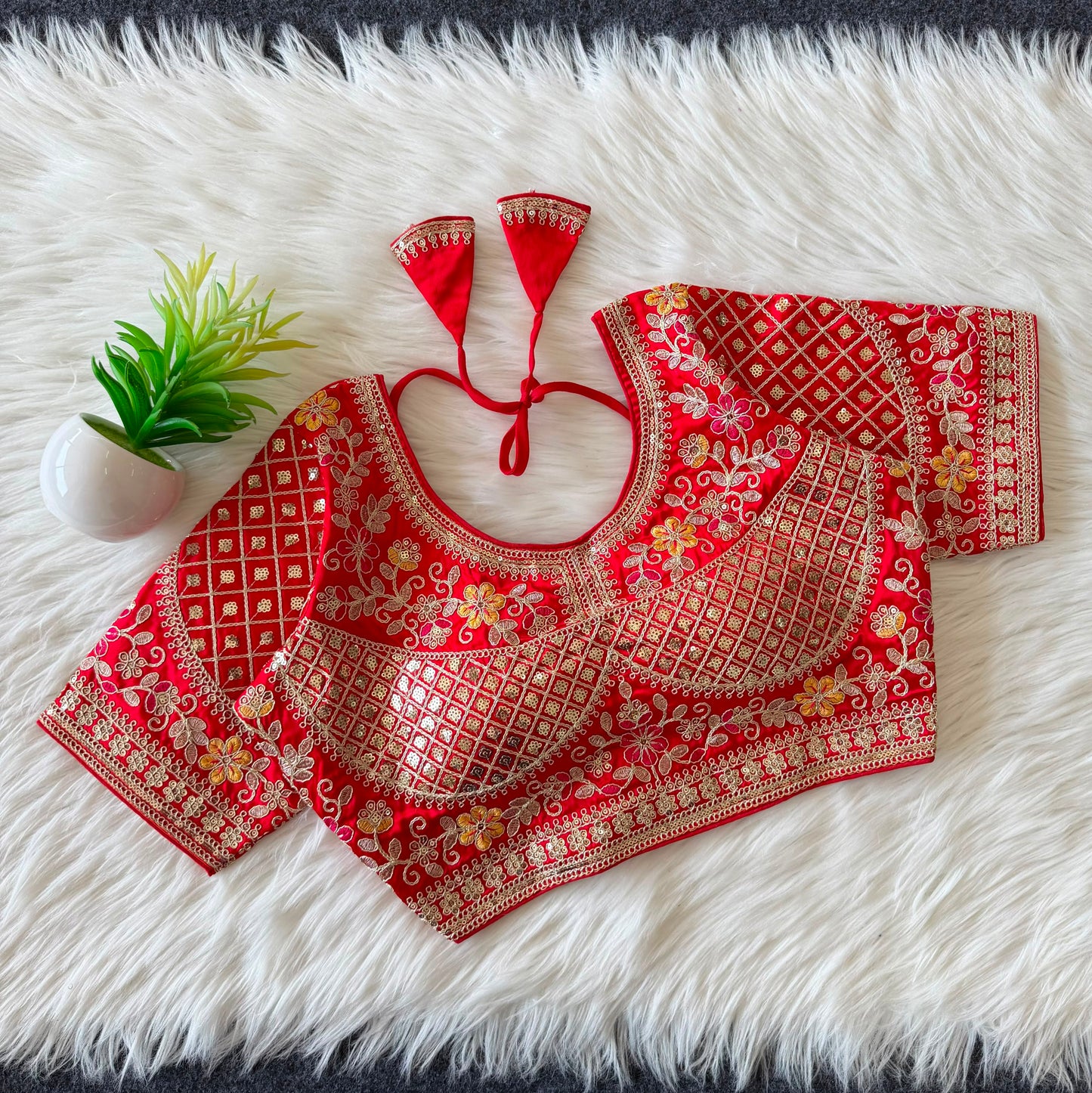 A beautiful  work with  sequence all over ready made blouse